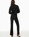 Back view of Siamo Firenze black tailored pants, designed to contour the body and elongate the silhouette with a flattering flare cut.